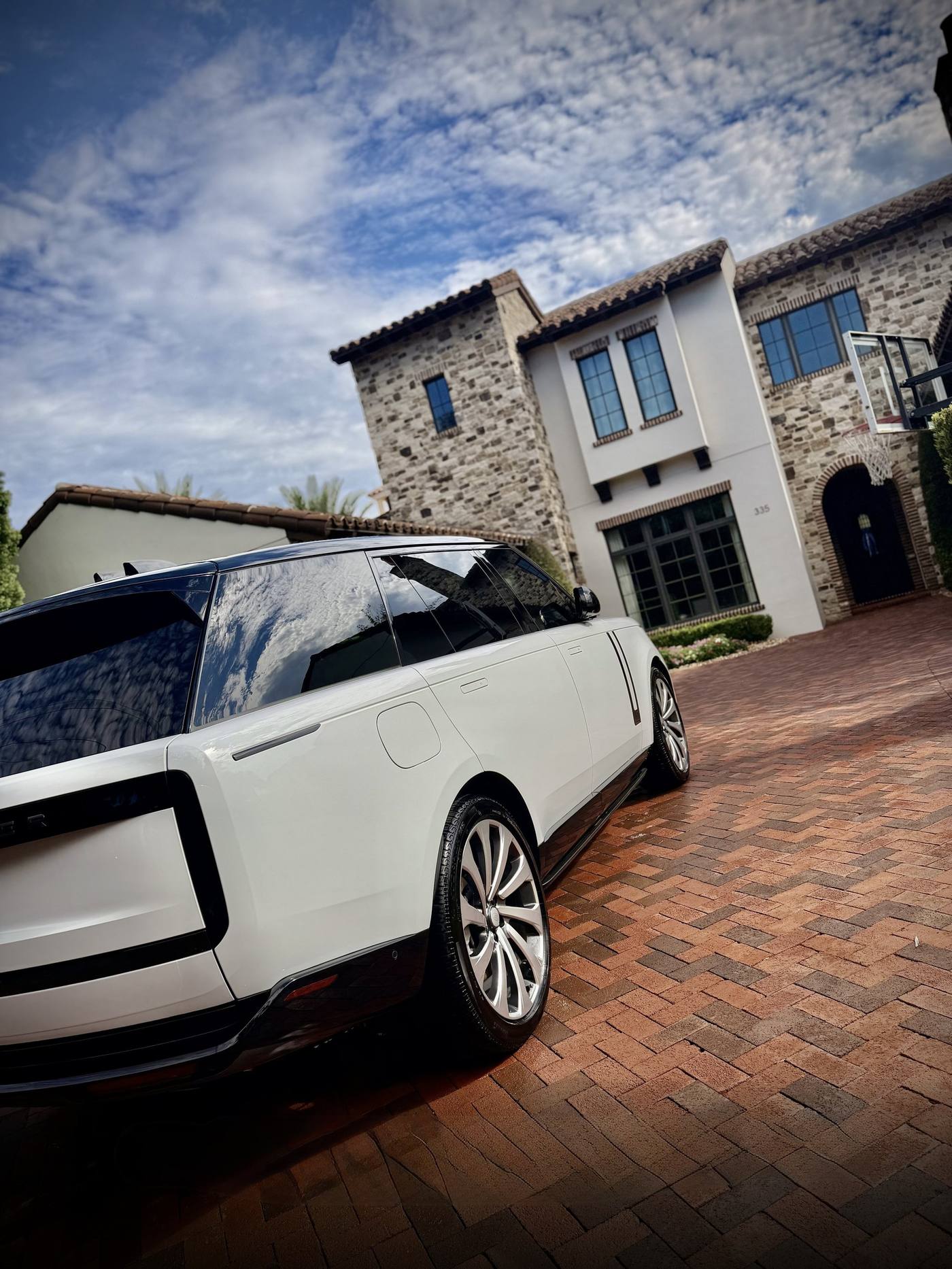 White Range Rover after a driveway detail